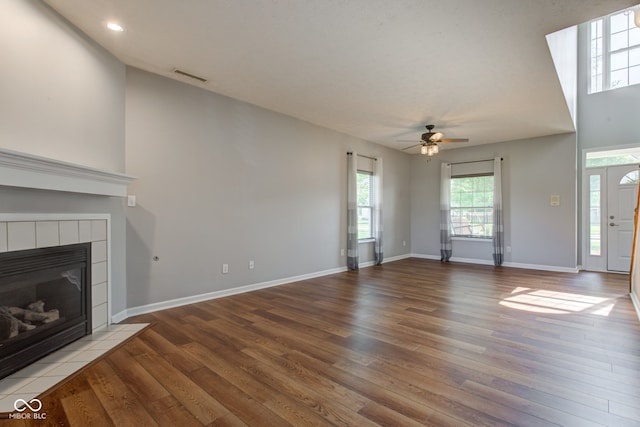 2234 Burgundy Way, Plainfield, IN 46168 - unfurnished living room featuring ceiling fan, wood finished floors, a fireplace, recessed lighting, and baseboards