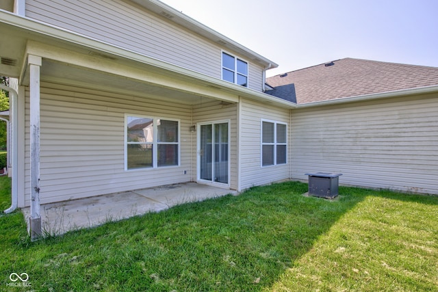 2234 Burgundy Way, Plainfield, IN 46168 - rear view of house with a lawn, a patio area, and a shingled roof