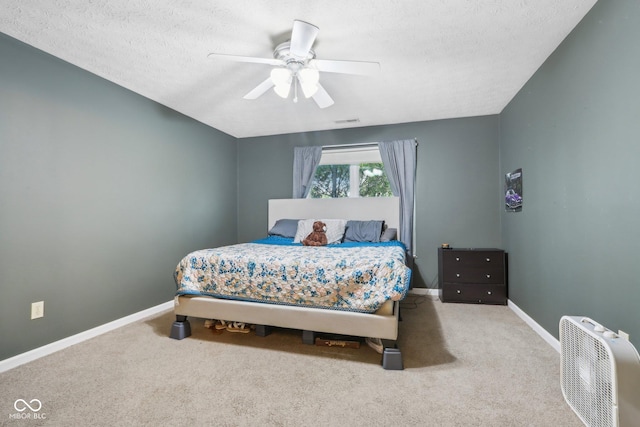 2114 Turning Leaf Dr, Franklin, IN 46131 - carpeted bedroom featuring baseboards, ceiling fan, and a textured ceiling