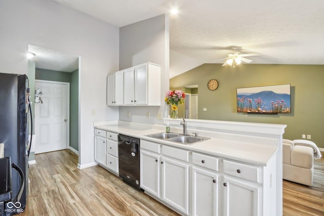 2114 Turning Leaf Dr, Franklin, IN 46131 - kitchen featuring a sink, black appliances, a peninsula, light wood-style flooring, and ceiling fan