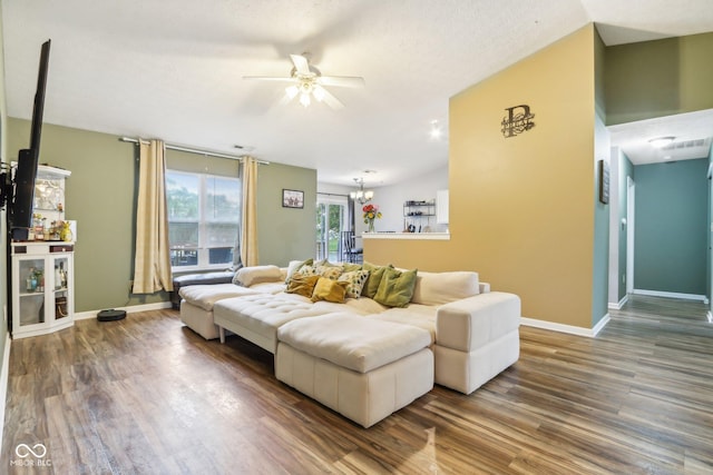 2114 Turning Leaf Dr, Franklin, IN 46131 - living room with wood finished floors, a ceiling fan, a chandelier, and baseboards