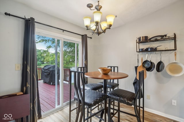 2114 Turning Leaf Dr, Franklin, IN 46131 - dining space with a chandelier, light wood-style flooring, and baseboards