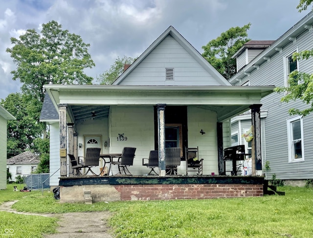 1139 S 7th St, Terre Haute, IN 47802 - view of front of house with a porch and a front yard