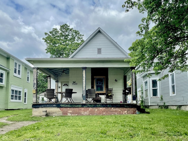 1139 S 7th St, Terre Haute, IN 47802 - view of front facade featuring a front lawn and a porch