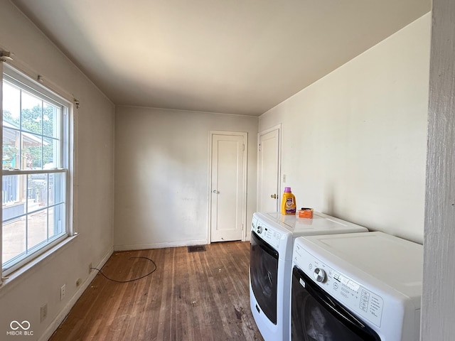 4853 Wentworth Blvd, Indianapolis, IN 46201 - washroom featuring washing machine and clothes dryer and dark wood-style flooring