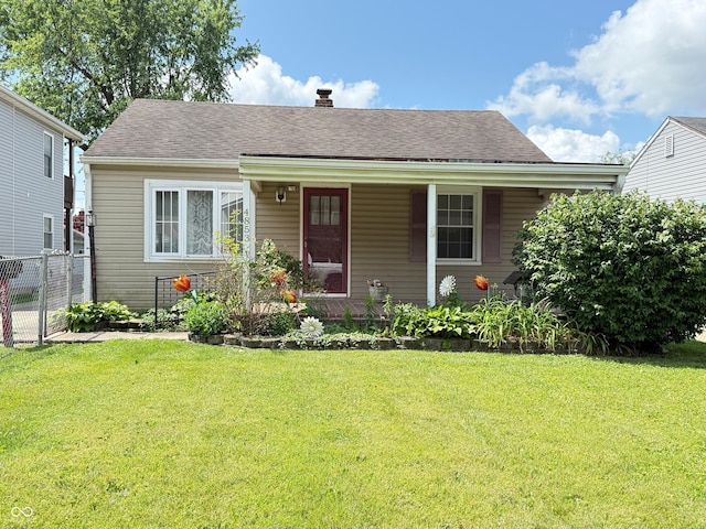 4853 Wentworth Blvd, Indianapolis, IN 46201 - view of front of home with a chimney, roof with shingles, and a porch