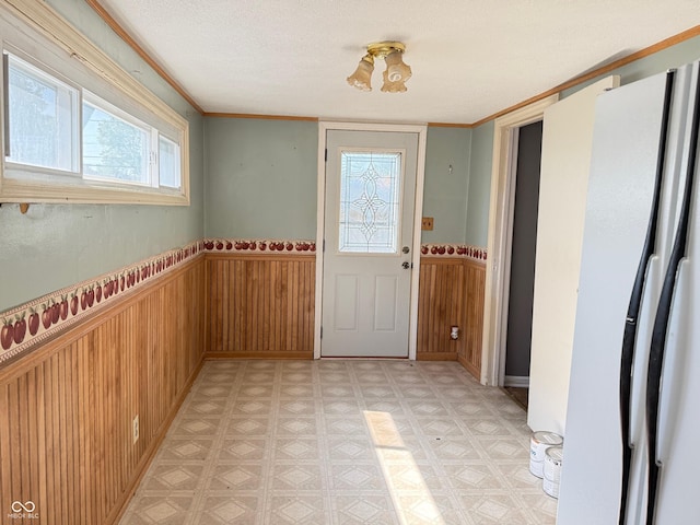 4853 Wentworth Blvd, Indianapolis, IN 46201 - doorway with wainscoting, wooden walls, and light flooring