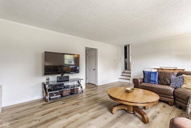 7935 N County Road 650 E, Brownsburg, IN 46112 - living room with stairway, wood finished floors, ornamental molding, and a textured ceiling