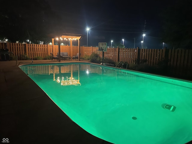 7935 N County Road 650 E, Brownsburg, IN 46112 - pool at twilight featuring a fenced backyard and a patio area