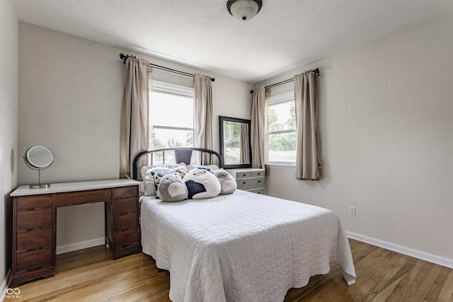 7935 N County Road 650 E, Brownsburg, IN 46112 - bedroom with light wood-type flooring and baseboards