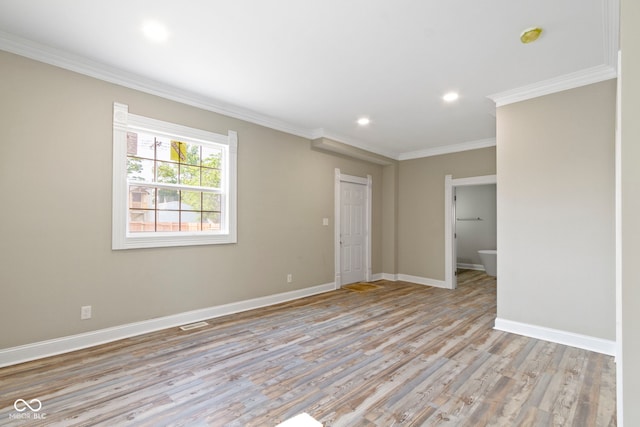 2111 S A St, Elwood, IN 46036 - empty room featuring light wood-style floors, ornamental molding, baseboards, recessed lighting, and a smoke detector