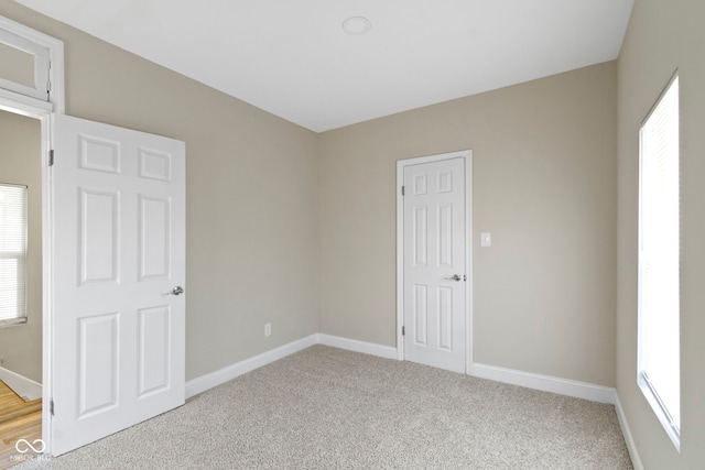 2111 S A St, Elwood, IN 46036 - empty room featuring baseboards and light colored carpet