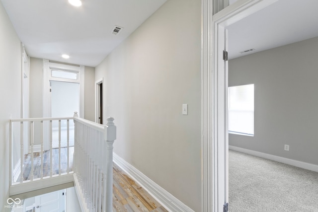 2111 S A St, Elwood, IN 46036 - corridor featuring an upstairs landing, baseboards, and recessed lighting