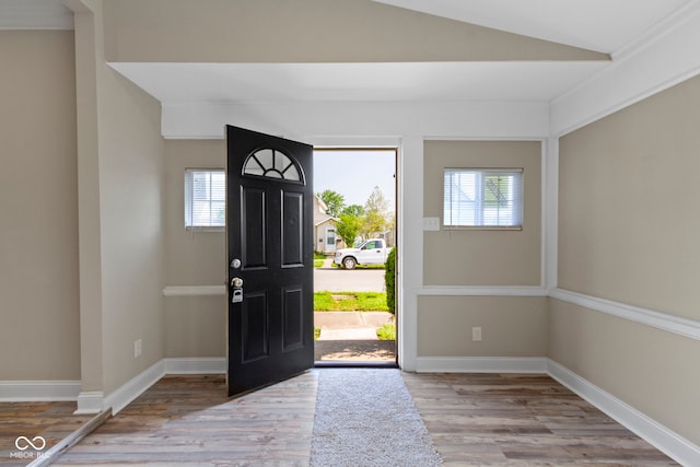 2111 S A St, Elwood, IN 46036 - foyer entrance featuring wood finished floors, vaulted ceiling, and baseboards