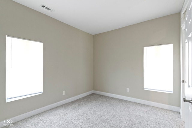 2111 S A St, Elwood, IN 46036 - empty room with carpet flooring, baseboards, and plenty of natural light