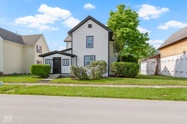 2111 S A St, Elwood, IN 46036 - traditional home featuring a front yard and board and batten siding