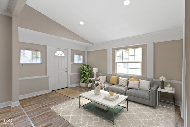 2111 S A St, Elwood, IN 46036 - living area with light wood finished floors, recessed lighting, lofted ceiling, baseboards, and ornamental molding