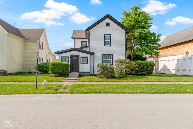 2111 S A St, Elwood, IN 46036 - traditional home featuring a front yard and board and batten siding