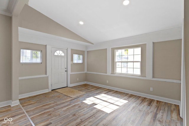 2111 S A St, Elwood, IN 46036 - foyer featuring light wood finished floors, vaulted ceiling, recessed lighting, and baseboards