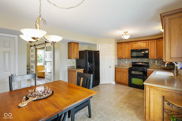 101 Meadowview Dr, Mooresville, IN 46158 - kitchen featuring black appliances, a sink, tasteful backsplash, brown cabinetry, and pendant lighting