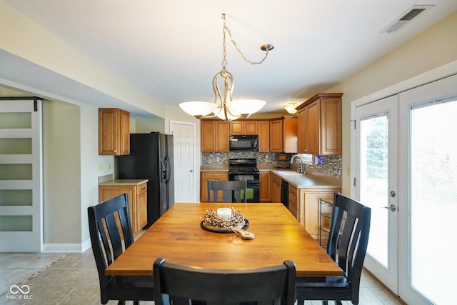 101 Meadowview Dr, Mooresville, IN 46158 - dining room featuring healthy amount of natural light, light tile patterned floors, and baseboards