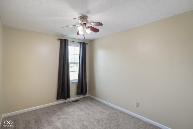101 Meadowview Dr, Mooresville, IN 46158 - empty room featuring ceiling fan, light colored carpet, baseboards, and a textured ceiling
