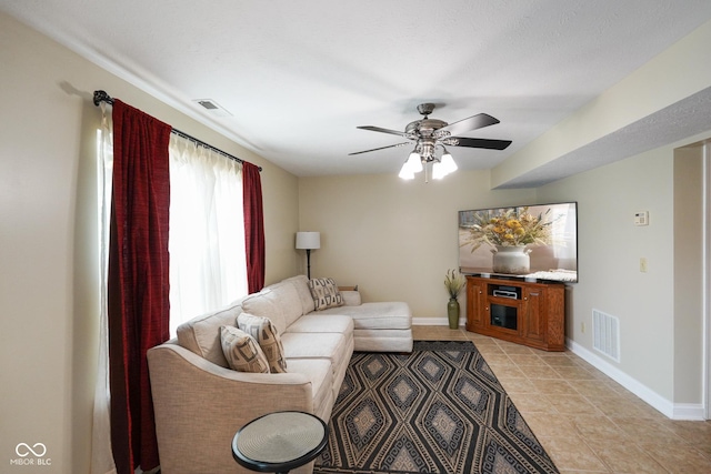 101 Meadowview Dr, Mooresville, IN 46158 - living area with a ceiling fan, baseboards, and light tile patterned floors