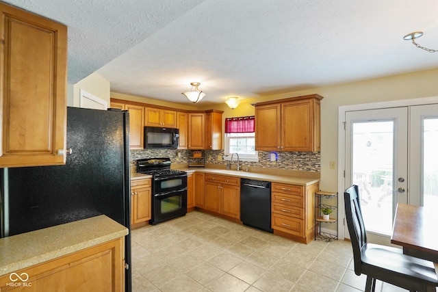 101 Meadowview Dr, Mooresville, IN 46158 - kitchen with black appliances, tasteful backsplash, light countertops, and brown cabinets