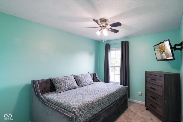 101 Meadowview Dr, Mooresville, IN 46158 - bedroom featuring light colored carpet, a ceiling fan, baseboards, and a textured ceiling