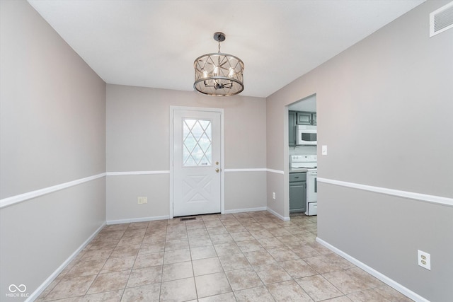 8205 Picadilly Ln, Indianapolis, IN 46256 - entryway with a chandelier and baseboards