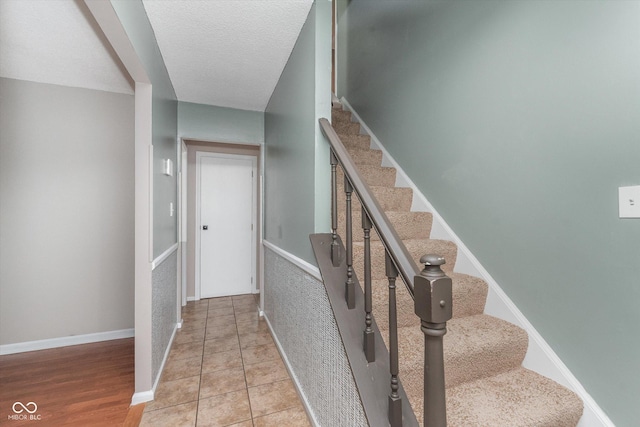8205 Picadilly Ln, Indianapolis, IN 46256 - stairs with baseboards and a textured ceiling