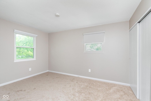 8205 Picadilly Ln, Indianapolis, IN 46256 - unfurnished bedroom featuring a closet, carpet flooring, and baseboards