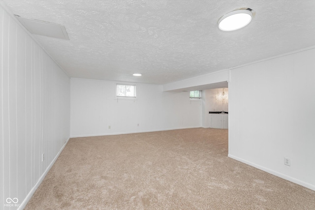 8205 Picadilly Ln, Indianapolis, IN 46256 - below grade area featuring carpet floors, a textured ceiling, and baseboards