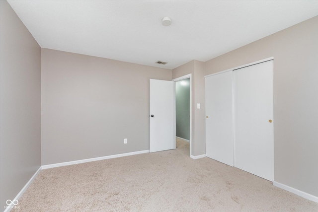 8205 Picadilly Ln, Indianapolis, IN 46256 - unfurnished bedroom featuring carpet, a closet, and baseboards