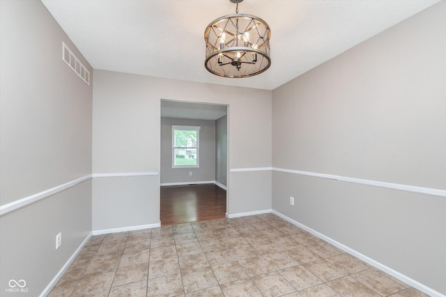 8205 Picadilly Ln, Indianapolis, IN 46256 - unfurnished room featuring a chandelier and baseboards