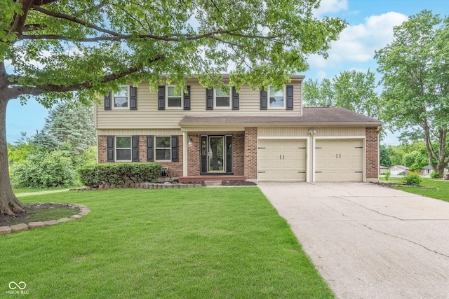 8205 Picadilly Ln, Indianapolis, IN 46256 - view of front of house with driveway, brick siding, a front lawn, and an attached garage