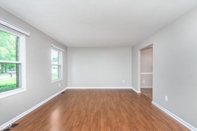 8205 Picadilly Ln, Indianapolis, IN 46256 - spare room featuring healthy amount of natural light, wood finished floors, and baseboards