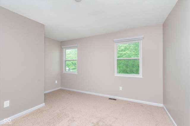 8205 Picadilly Ln, Indianapolis, IN 46256 - spare room featuring carpet floors and baseboards