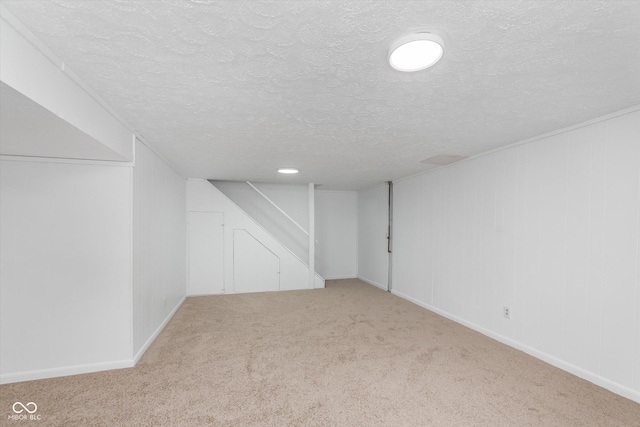 8205 Picadilly Ln, Indianapolis, IN 46256 - finished basement featuring a textured ceiling, carpet floors, and baseboards