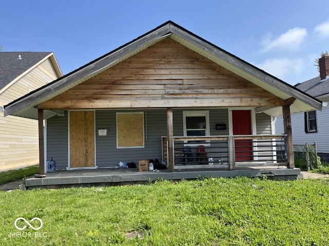 1844 E Minnesota St, Indianapolis, IN 46203 - view of front of property featuring a porch and a front yard