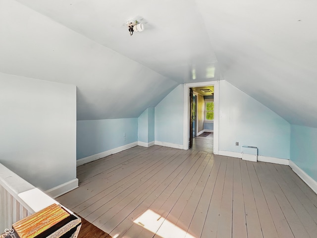 621 N Livingston Ave, Indianapolis, IN 46222 - additional living space with wood-type flooring, lofted ceiling, and baseboards