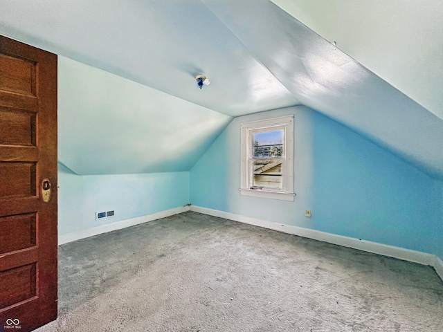 621 N Livingston Ave, Indianapolis, IN 46222 - additional living space with baseboards, lofted ceiling, and carpet floors