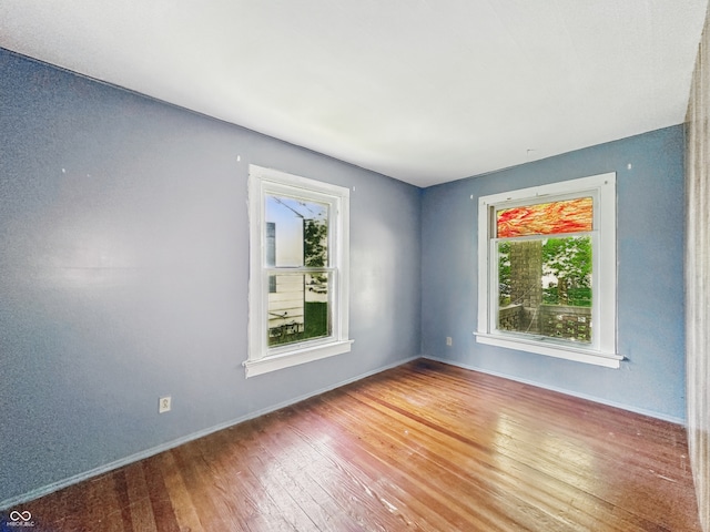621 N Livingston Ave, Indianapolis, IN 46222 - empty room featuring healthy amount of natural light, wood finished floors, and baseboards
