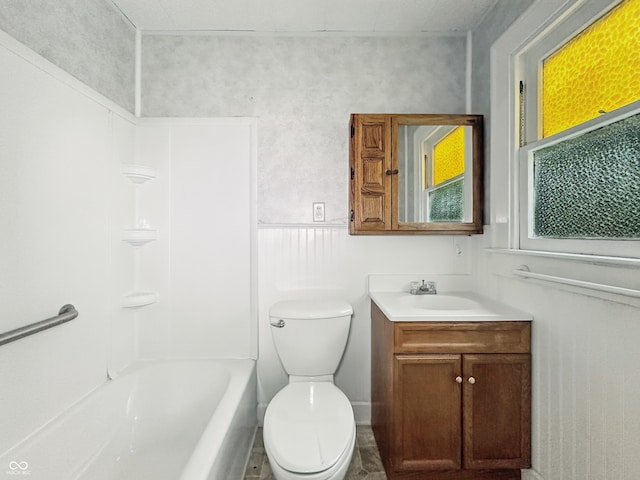 621 N Livingston Ave, Indianapolis, IN 46222 - full bathroom featuring vanity, toilet, shower / washtub combination, and wainscoting