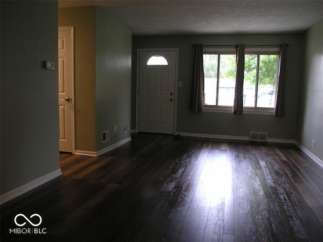 3456 S Sadlier Dr S, Indianapolis, IN 46239 - entrance foyer with dark wood-type flooring and baseboards
