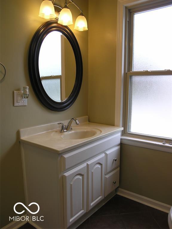 3456 S Sadlier Dr S, Indianapolis, IN 46239 - bathroom featuring vanity and tile patterned floors