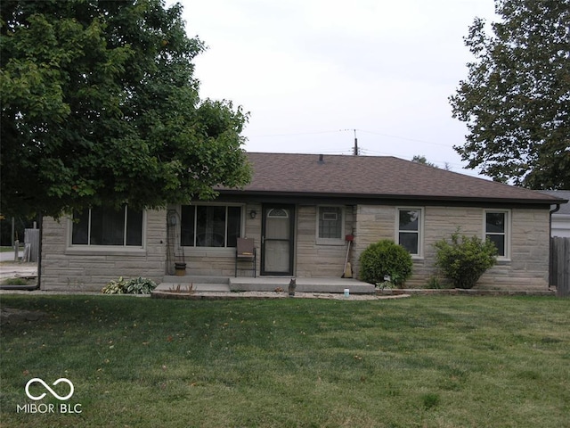 3456 S Sadlier Dr S, Indianapolis, IN 46239 - ranch-style home with stone siding, a front lawn, and a shingled roof
