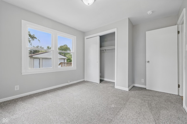 450 N Fenton Ave, Indianapolis, IN 46219 - unfurnished bedroom featuring carpet floors and a closet