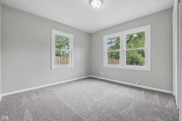 450 N Fenton Ave, Indianapolis, IN 46219 - empty room with baseboards and carpet
