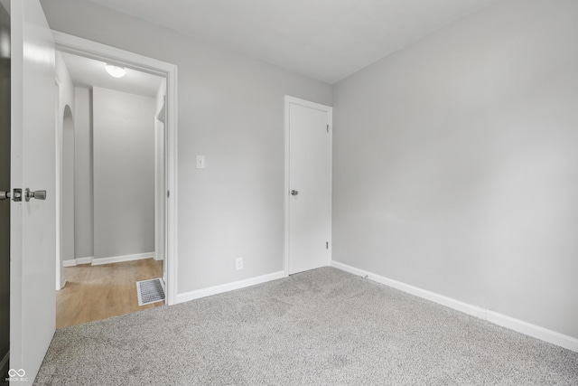 450 N Fenton Ave, Indianapolis, IN 46219 - unfurnished bedroom featuring carpet and baseboards